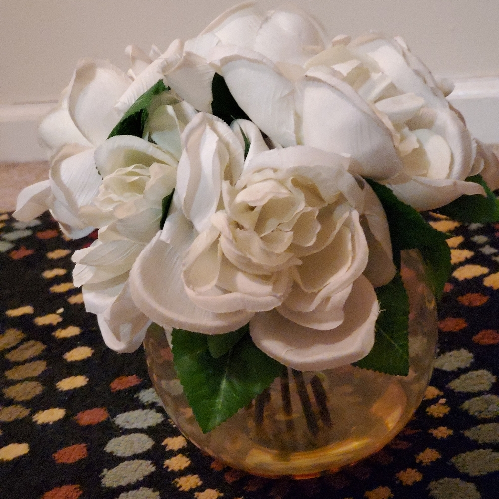 Glass round vase with white fake flowers